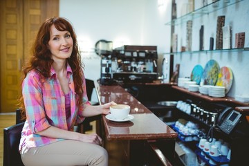 Fototapeta na wymiar Mature student smiling in cafe