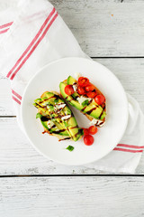 two sandwich with avocado and tomatoes
