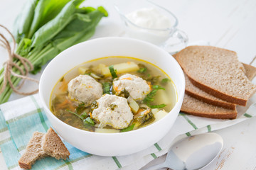 Sorrel soup in white bowl