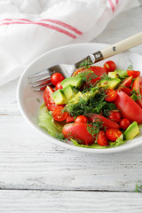 fresh salad with avocado and tomatoes