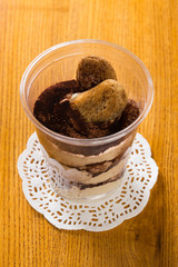 Creamy dessert in plastic cup