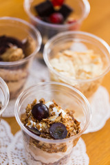 Creamy dessert in plastic cup