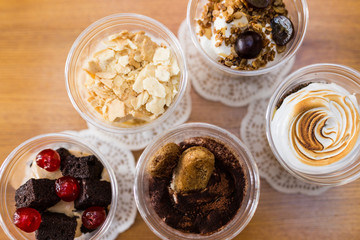 Creamy dessert in plastic cup