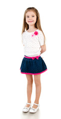 Smiling adorable little girl in skirt isolated