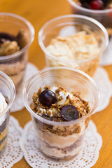Creamy dessert in plastic cup