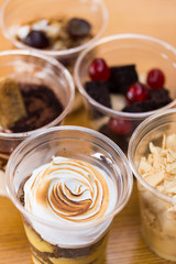 Creamy dessert in plastic cup