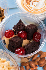 Creamy dessert in plastic cup