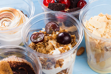 Creamy dessert in plastic cup
