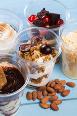 Creamy dessert in plastic cup