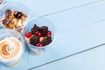 Creamy dessert in plastic cup