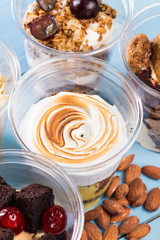 Creamy dessert in plastic cup