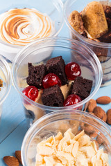 Creamy dessert in plastic cup