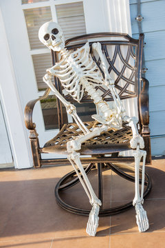 skeleton sit at the armchair and wait