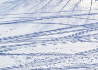 human footprints and of the cross-country ski tracks on the snow