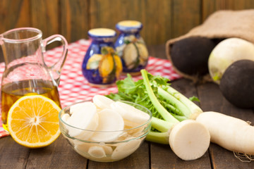    Daikon radish salad on wooden background
