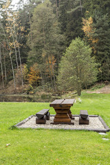 Sitting outside in the garden at a wooden table