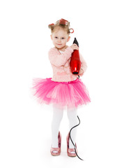 Little girl with hairdryer.
