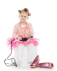 Little girl with curling iron.