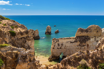 Fototapeta na wymiar Summer panorama of sea landscape. The cliffs in Albufeira, Portugal.