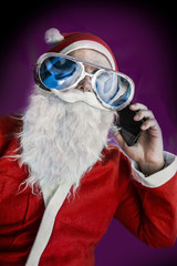 Santa Claus is dressed in a ridiculous huge glasses says smartphone phone