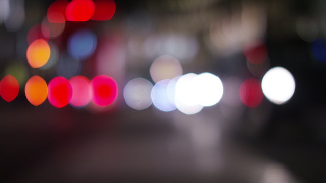 4K Blurred background lights of moving traffic at night in the city, in slow motion
