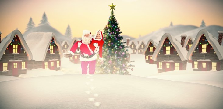 Composite image of santa and mrs claus smiling at camera 
