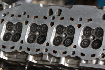Cylinder head of the engine and damaged from industry work, removed cylinder head for inspect and replace intake and exhaust valve.