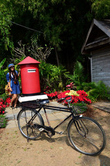 Fototapeta na wymiar Thai woman portrait with postbox at Jim Thompson Farm