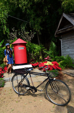 Thai woman portrait with postbox at Jim Thompson Farm