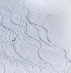 Snowboarder downhill on off piste slope with newly-fallen snow