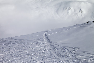 Fototapeta na wymiar Off-piste slope with new-fallen snow