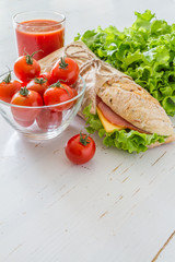 Sandwich with cheese abd ham, salad and tomatoes
