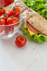 Sandwich with cheese abd ham, salad and tomatoes