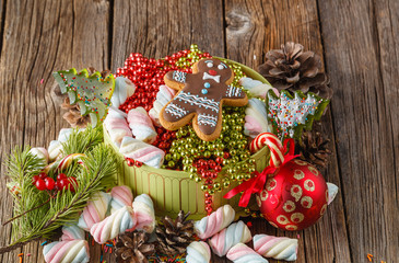 Christmas theme. Pine and red ball on wooden table