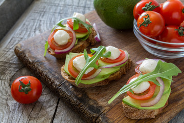 Avocado mozzarella and tomato bruscetta