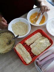 Preparazione di pesce impanato