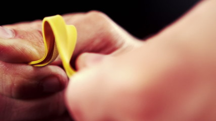 Hand pulling an elastic band
