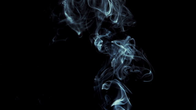 Smoke rising on black background