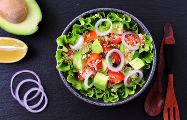 Vegetarian couscous salad, avocado, tomatoes, red onion with olive oil and parsley.