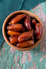 dried dates on a beautiful wooden background