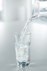 Drinking Water. Pour Water From Pitcher Into A Glass. Health, Diet, Hydratation Concept.
