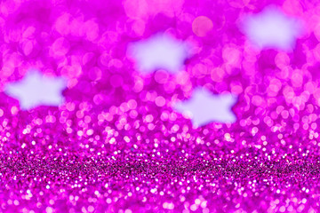 Festive Christmas background with stars. Abstract twinkled bright background with bokeh defocused lights