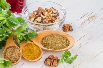Georgian sauce ingredients on white wood background