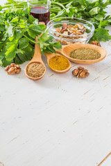 Georgian sauce ingredients on white wood background