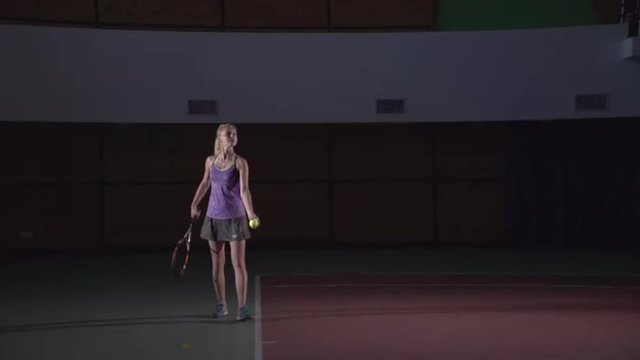  Serve (slow motion). Attractive girl playing tennis.Professional tennis payer