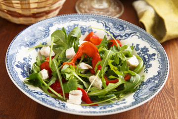 Arugula salad with turkey meat, baked capsicum and olives