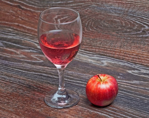 Fruit soda and an Apple on the table