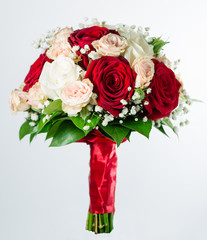 red bridal bouquet isolated on white background (shallow DOF)