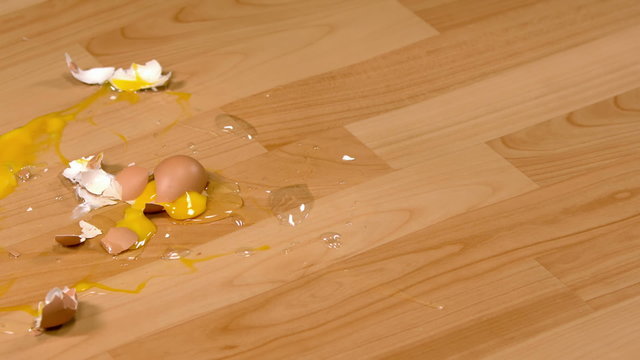 Egg smashing on a table