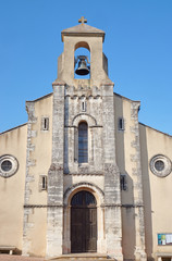 Fototapeta na wymiar The facade of a medieval church in Rochemaure, France.